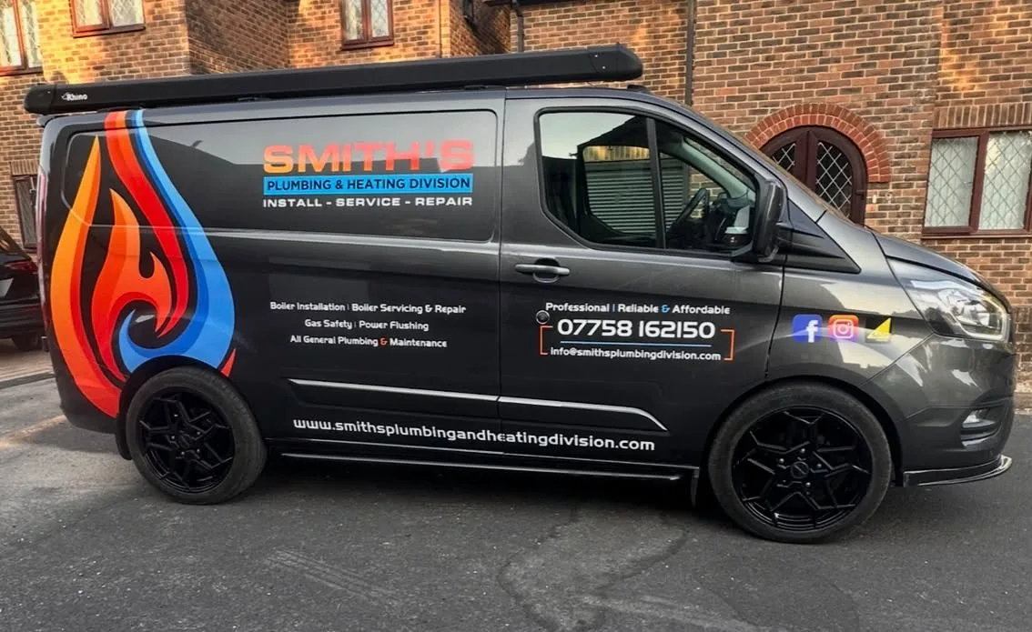 Smith's Plumbing and Heating Division branded van